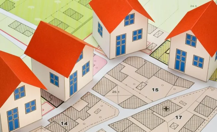 A stylised image of model buildings on a planned layout