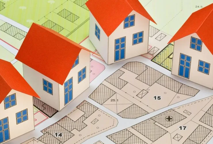 A stylised image of model buildings on a planned layout