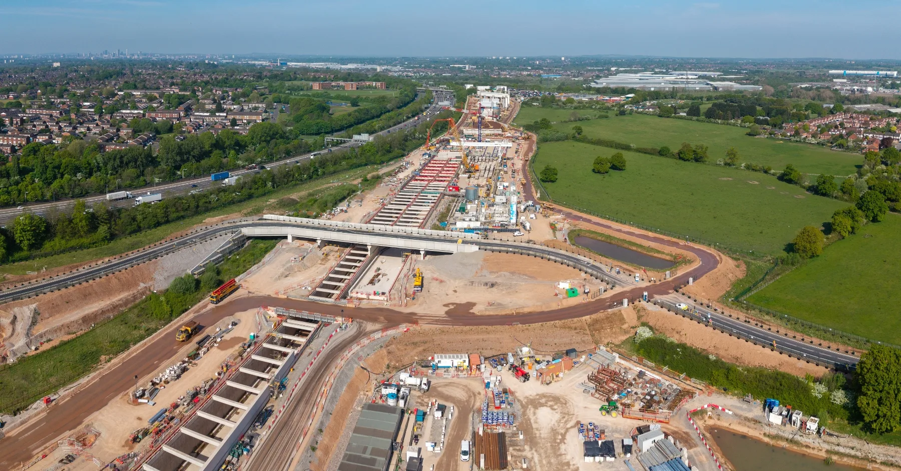 Construction sector UK Major UK infrastructure construction site with new road bridge, motorway and large-scale civil engineering works underway