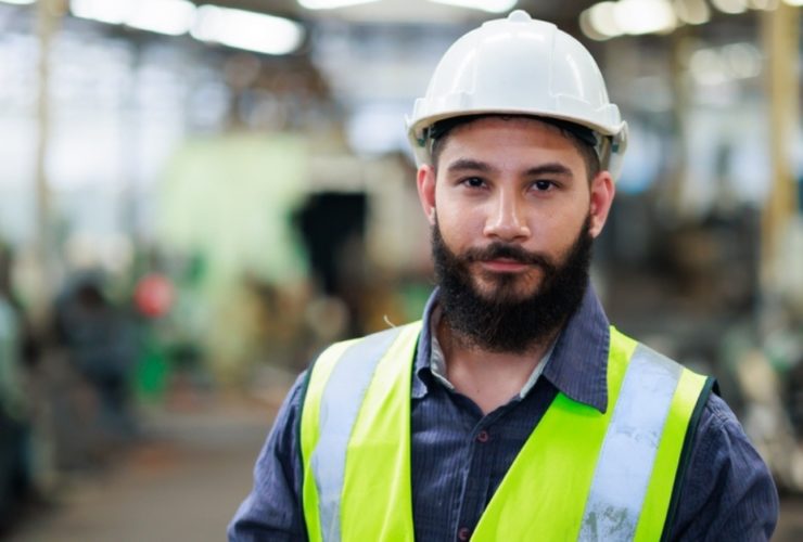 A young male construction worker having found his perfect construction job