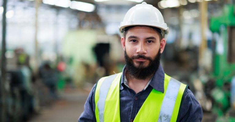 A young male construction worker having found his perfect construction job