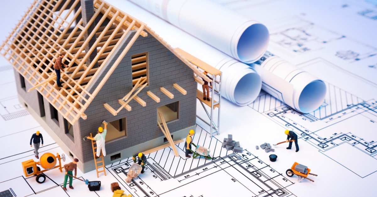stylised image of builders constructing a house