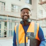 A happy health and safety inspector with a clipboard