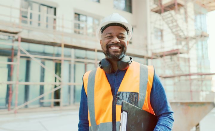 A happy health and safety inspector with a clipboard