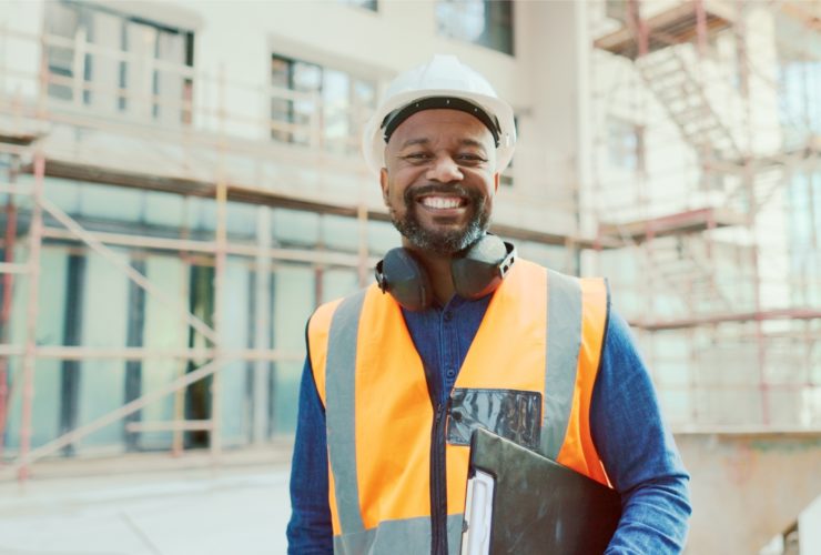 A happy health and safety inspector with a clipboard