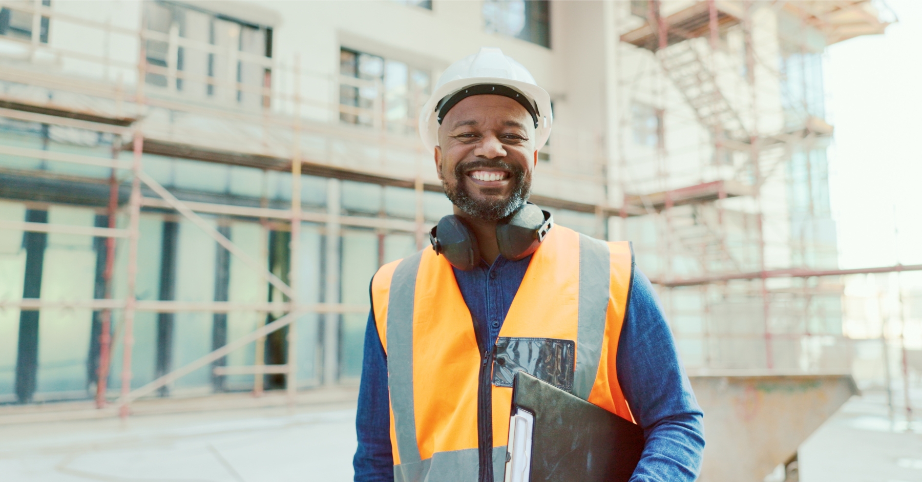 A happy health and safety inspector with a clipboard