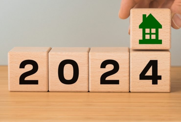 wooden blocks depicting the number 2024 with a green house above them